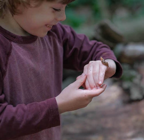 Kid playing with a slug