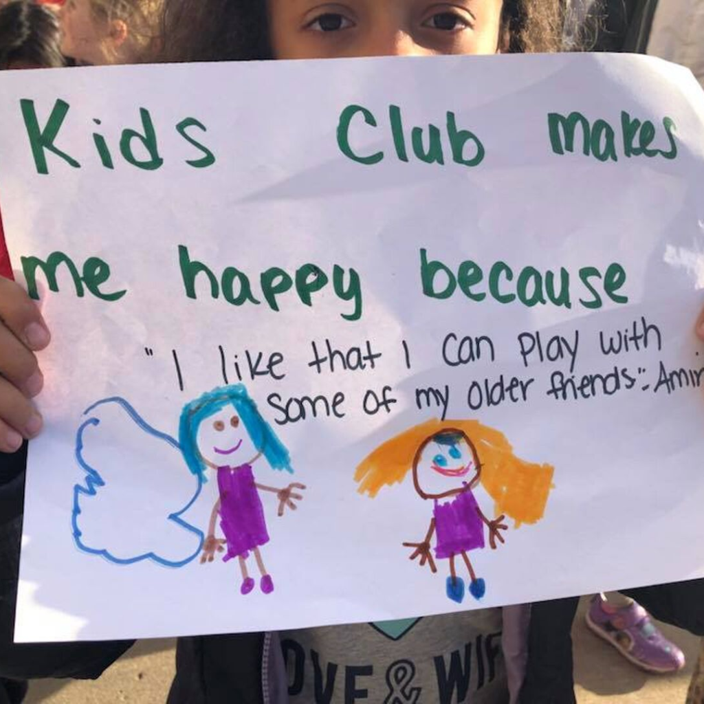 little girl with sign